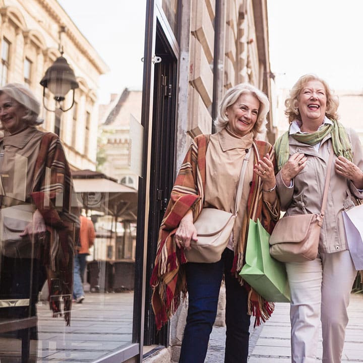 19- Women laughing while shopping - Waterstone Senior Living