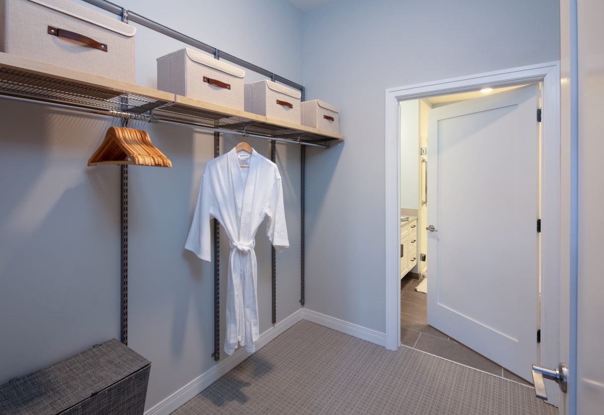 Waterstone on High Ridge model walk in closet leading to bathroom