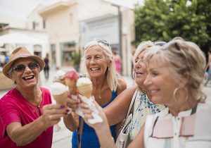 Four older woman on holiday in Cyprus are enjoying ice cream cones