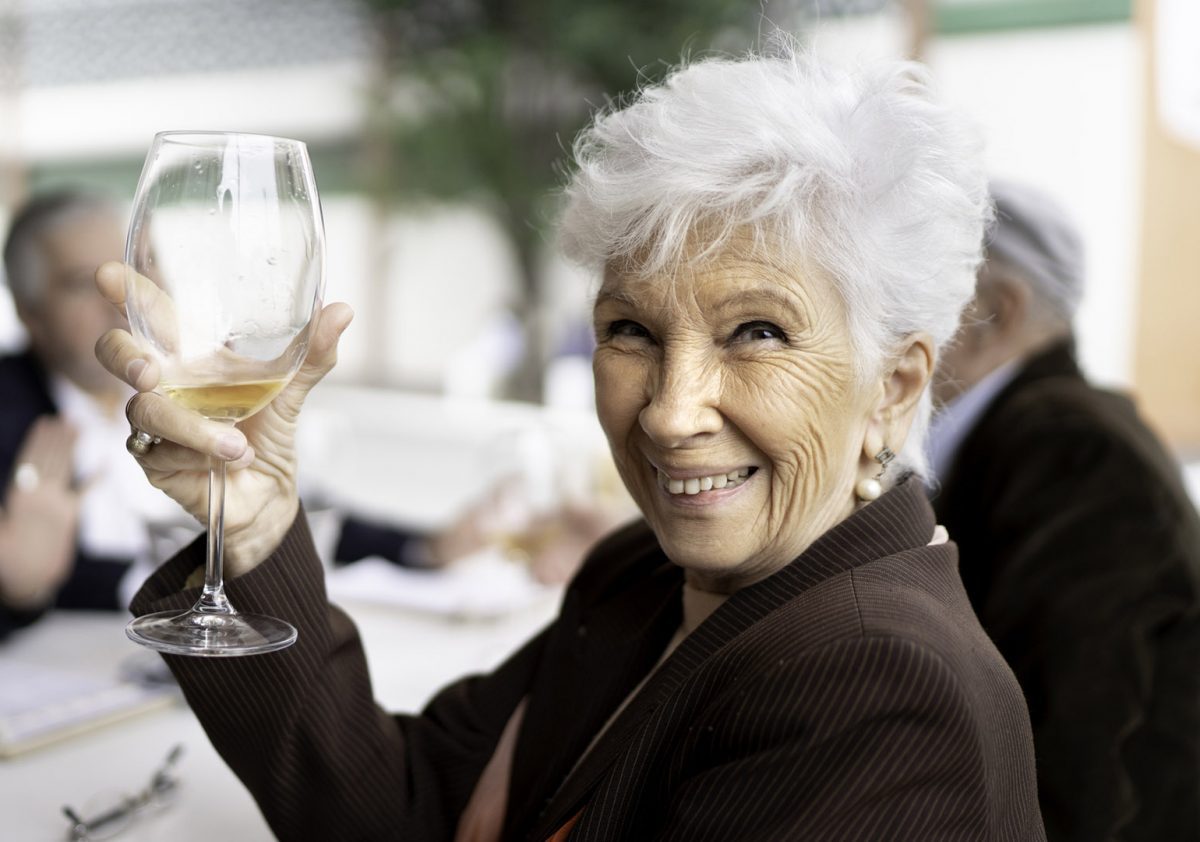 Portrait of smiling senior women holding a wine glass