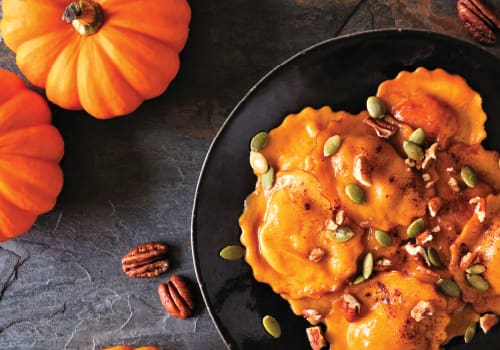 pumpkin ravioli with brown butter, toasted pecans and crispy pancetta;