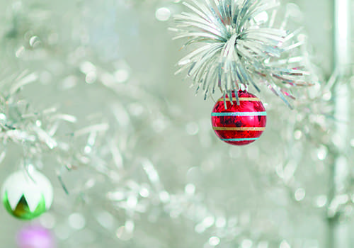 Retro Christmas ornaments on a aluminum christmas tree.