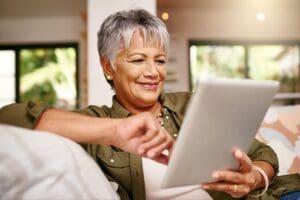 senior woman browsing on her tablet