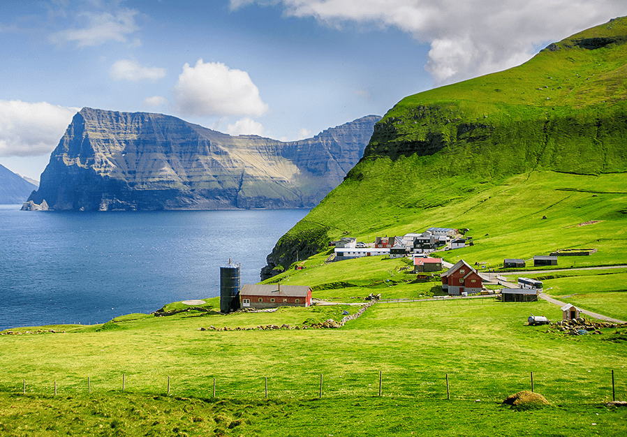 Denmark grassland with mountains and a lake in the background