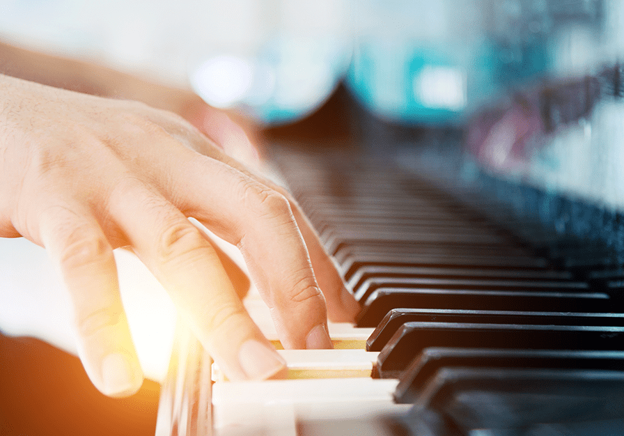 close up of fa person playing the piano