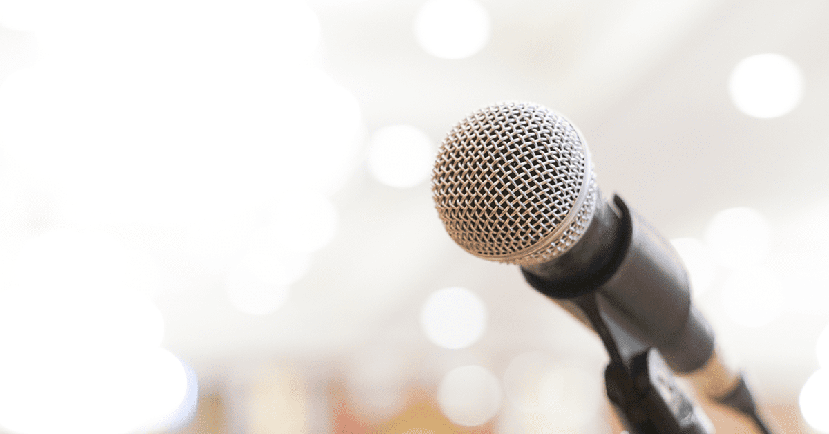 close up of a microphone on a lit stage