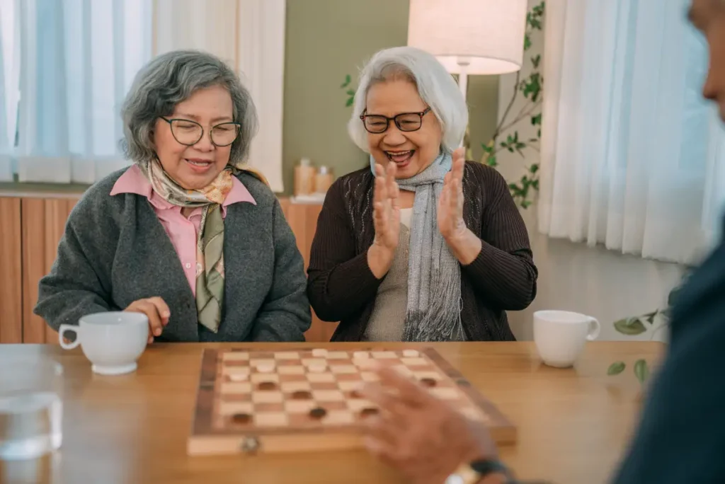 senior women playing checkers