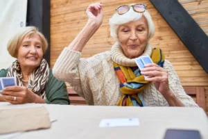 senior women playing a card game