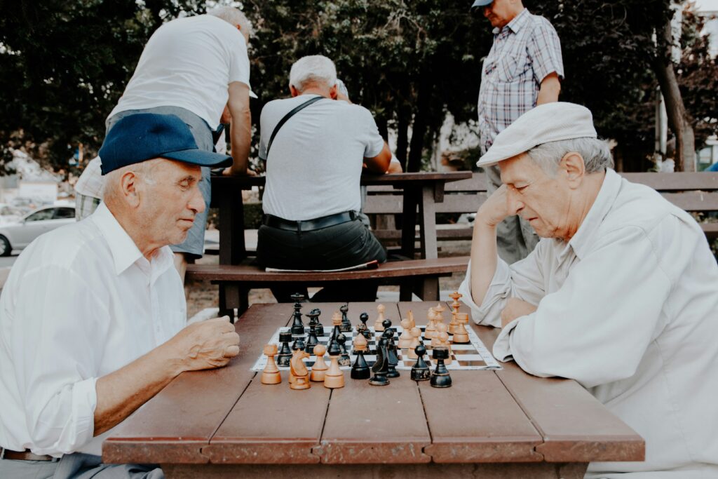 Hobbies for seniors: two older men play chess